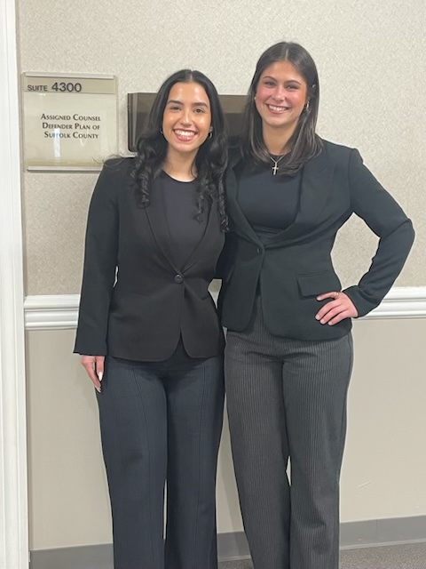 Two women in suits