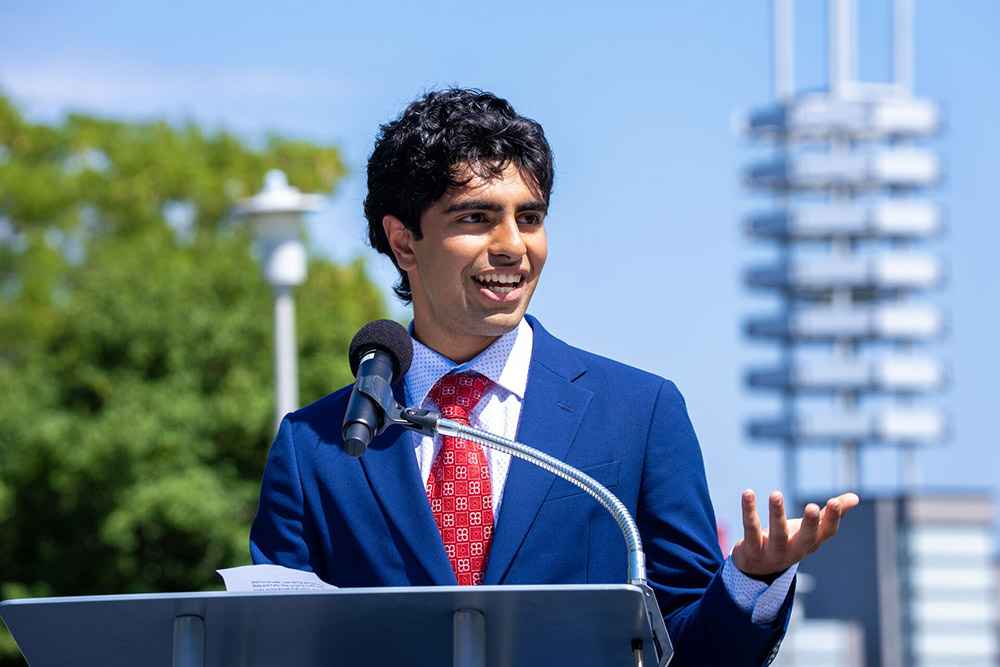 Undergraduate Student Government President Russell Erfan at a podium