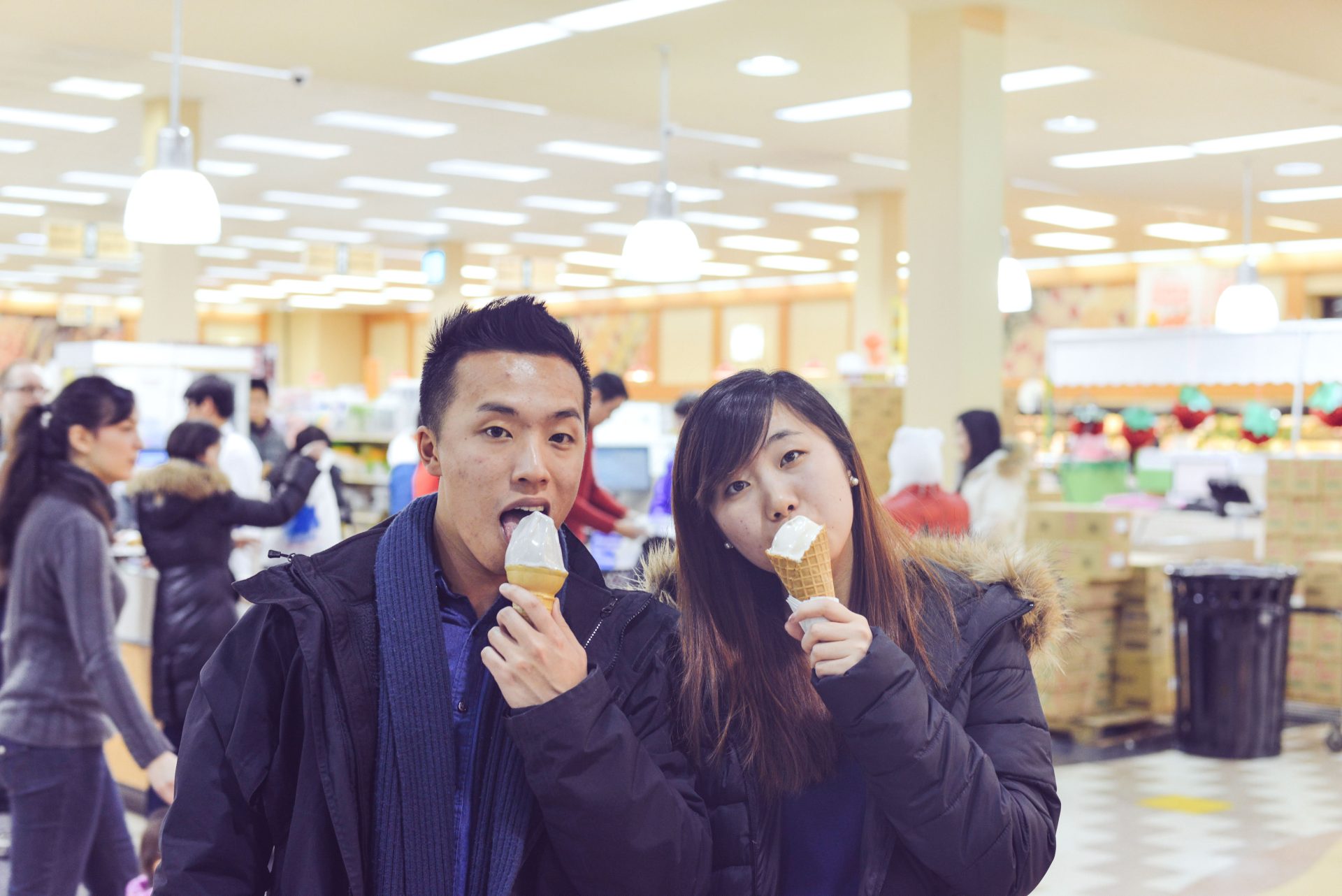 Ben and Ming enjoying ice cream cones.